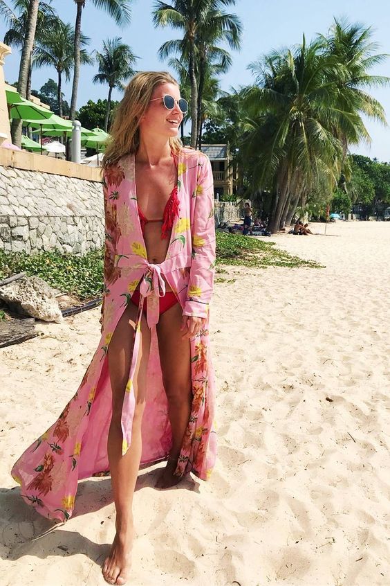 Picture Of a red fringe bikini and a long pink floral beach kimono .
