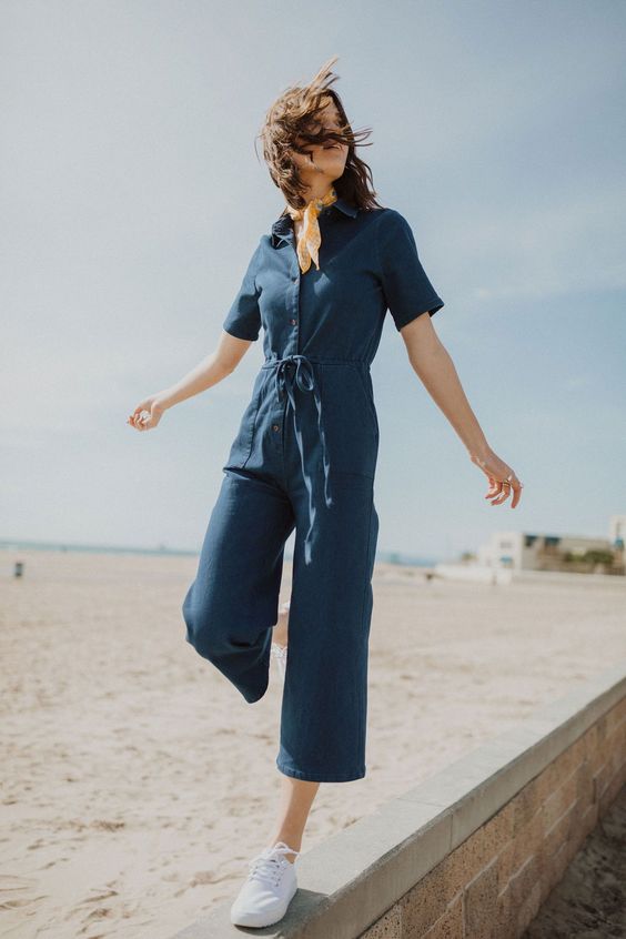 Picture Of a navy boiler suit with cropped pants, short sleeves .