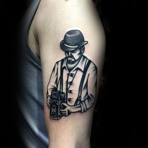 Picture Of Man with retro camera tattoo on the ha