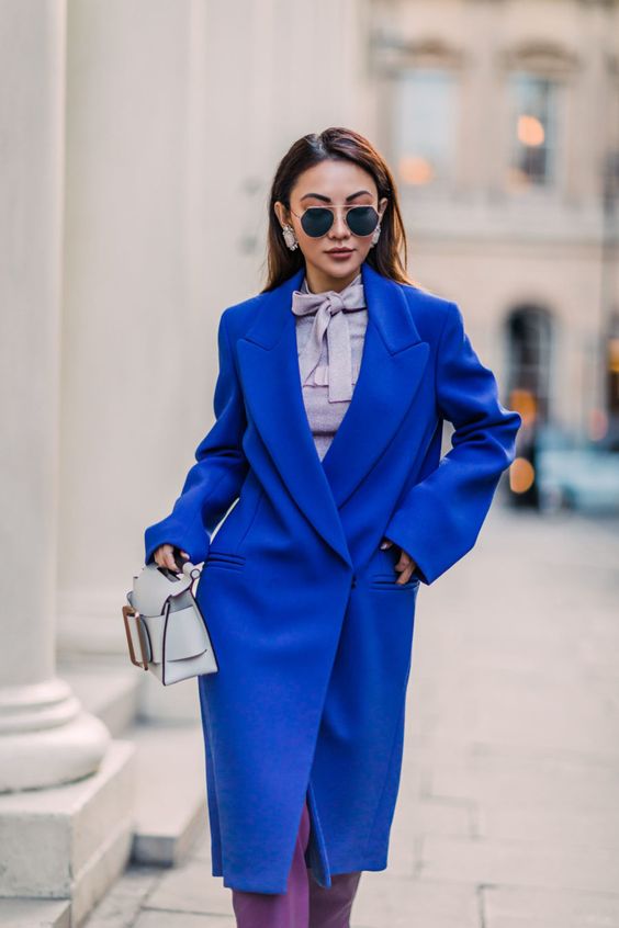 Picture Of an oversized classic blue coat is a trendy item for .