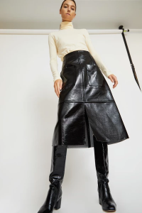 A classic a-line skirt with modern details. Patent faux black .