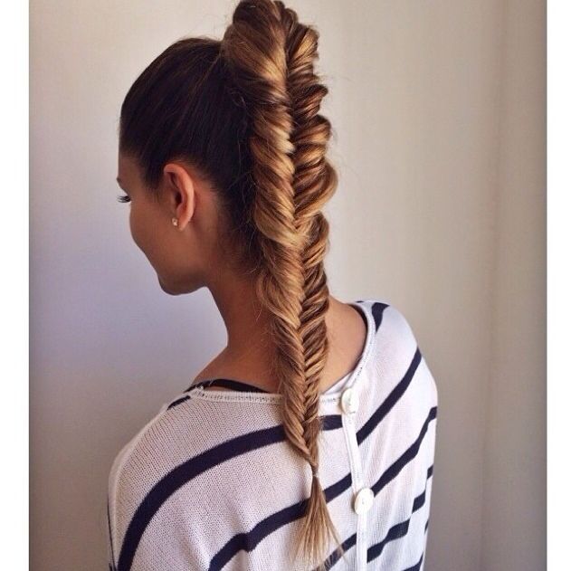 We love this Beyonce-esque high ponytail styled into a fishtail .