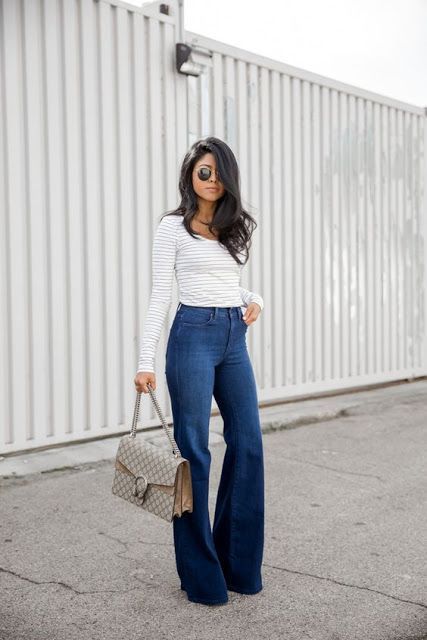 Street style | High waisted flared jeans over striped shirt #Women .