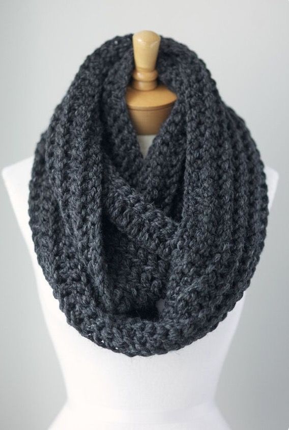 Grey knit infinity scarf. Useful for; keeping warm and layering .