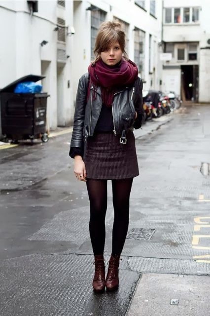 With leather jacket, shirt, mini skirt, black tights and ankle .