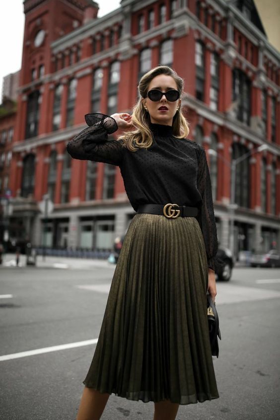 Midi pleated skirt with waistband made to wear day to night .