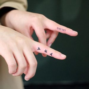 Tiny finger tattoos for girls; small tattoos for women; rose .