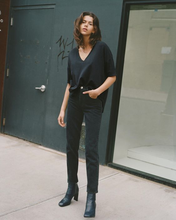 Picture Of a dark outfit with an oversized black top, black .