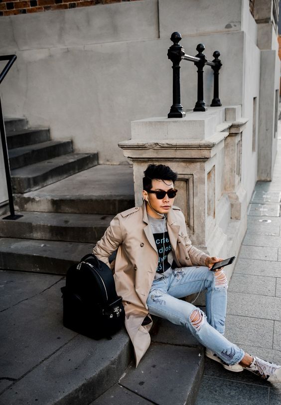 a casual fall look with a beige trench, ripped jeans, sneakers and .