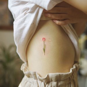 Tiny tulip by Nando | Tulip tattoo, Tattoo designs, Little tatto