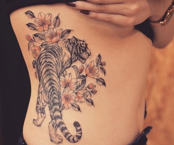 Japanese sakura and tiger tattoo design for women | Stylish tattoo .