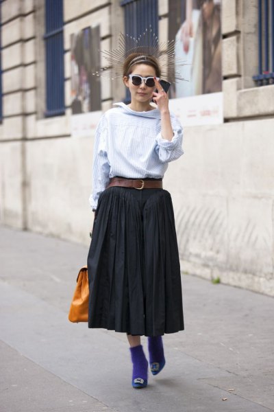 light blue blouse with black pleated midi skirt with belt