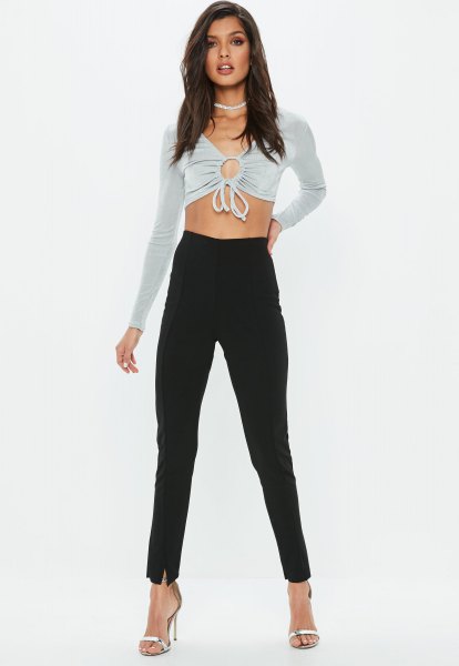 gray cropped long sleeve top with black high rise slim pants
