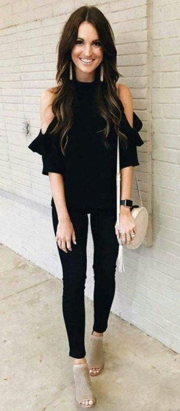 cold shoulder black blouse with skinny trousers and gray short open toe boots