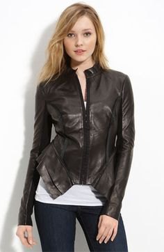 black peplum leather jacket with white vest top and skinny jeans