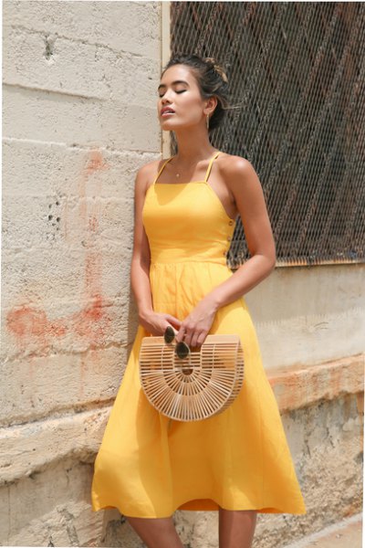 light yellow fit and a halterneck chiffon flared dress