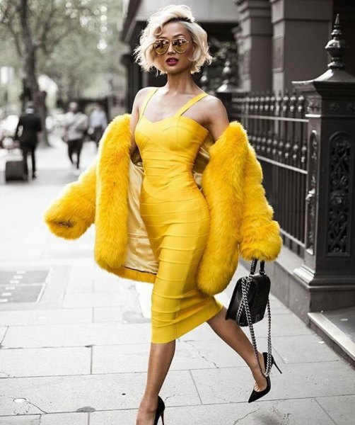 yellow sleeveless low cut midi bandage dress with faux fur coat