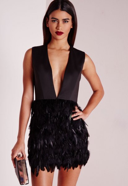 black mini dress with deep v-neckline and feathers