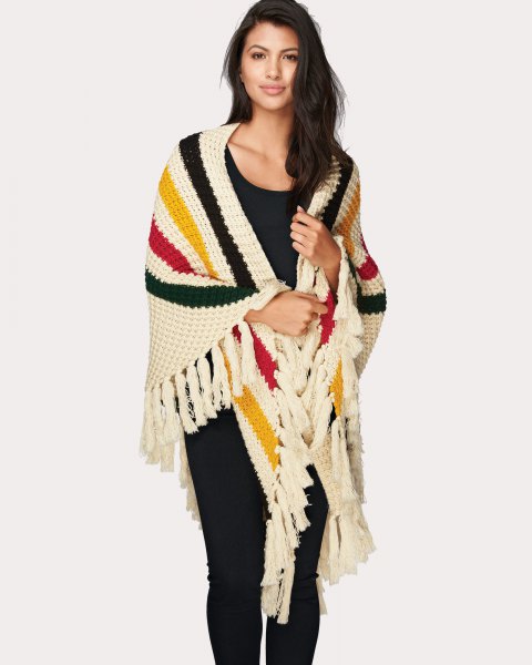 Multicolored striped knit fringes wrap up any black outfit