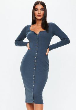 dark blue, figure-hugging long-sleeved dress with buttons