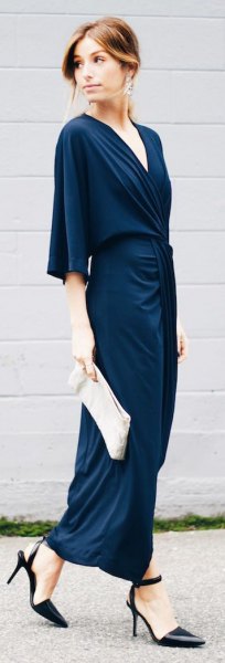 Dark blue maxi dress with half sleeves and white clutch