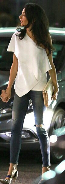 off-the-shoulder skinny jeans draped in white