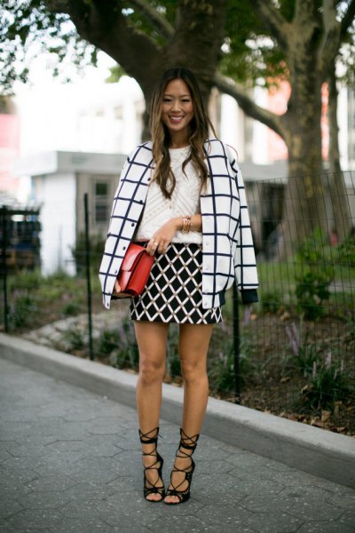 black and white checked wool coat with high-heeled black lace-up sandals