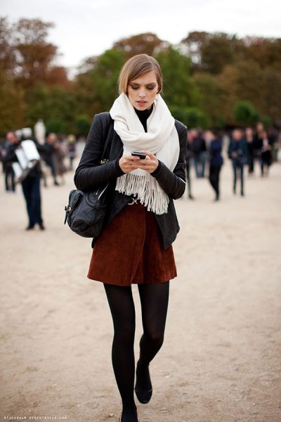 black blazer with white fringed scarf and mini skirt