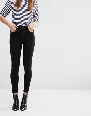 black and white striped t-shirt with high-waisted skinny jeans