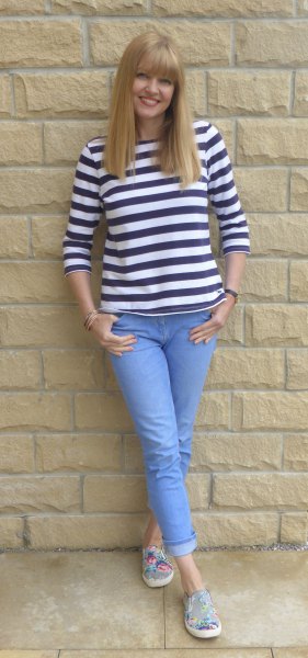 black and white striped t-shirt with light blue cuffed jeans