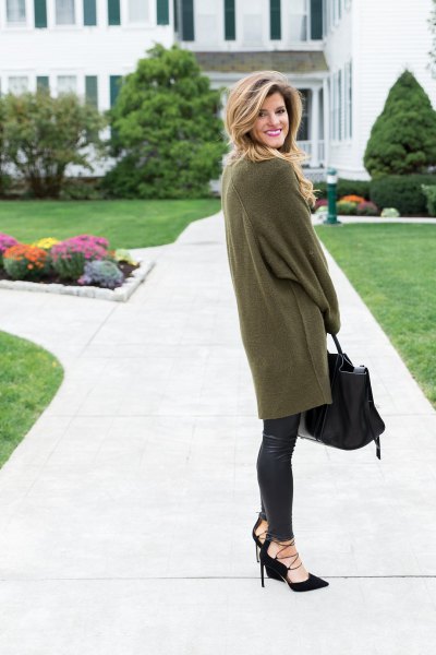 green oversized tunic sweater with long sleeves and black leather leggings