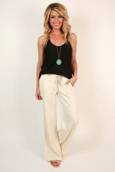 black vest top with white bell-bottoms