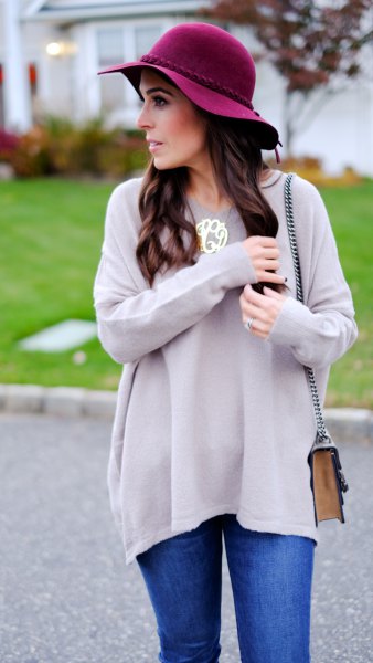 gray tunic sweater with black floppy hat
