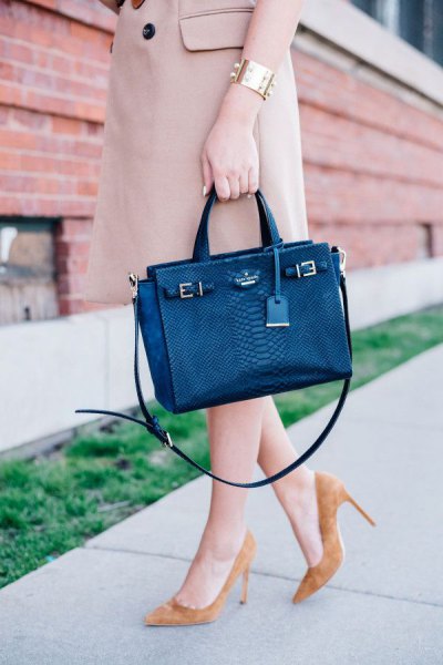 Dark blue briefcase with light pink longline trench coat