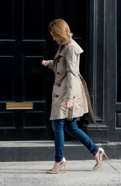 gray longline parka jacket with dark skinny jeans and gold heels