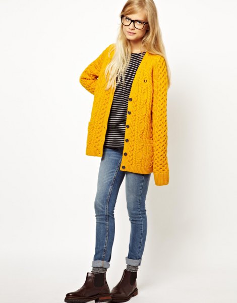 mustard yellow cardigan with cuffed jeans and leather boots