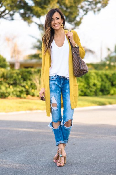 Longline mustard yellow cardigan with blue ripped jeans