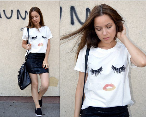 white funny graphic tee with black mini red skirt