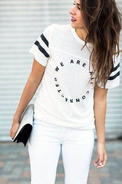white t-shirt with a cool print, matching skinny jeans and clutch with sequins