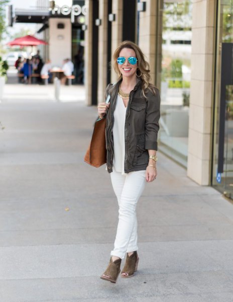 gray blazer with white blouse and cuffed jeans