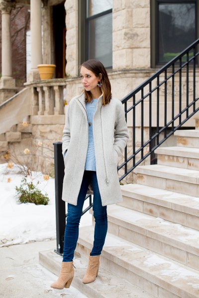 light gray long coat with sky blue sweater and skinny jeans
