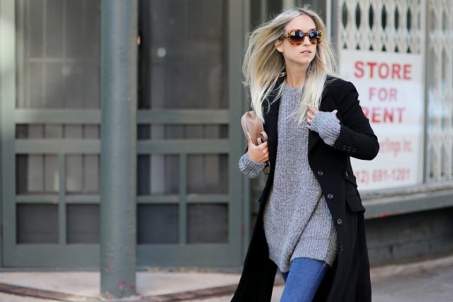 black coat with a gray ribbed sweater dress and blue skinny jeans