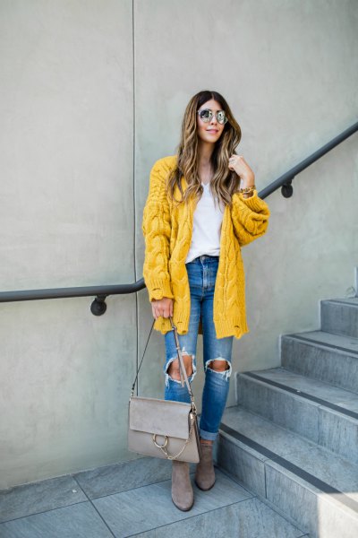 Lemon yellow knit cardigan with blue destroyed jeans