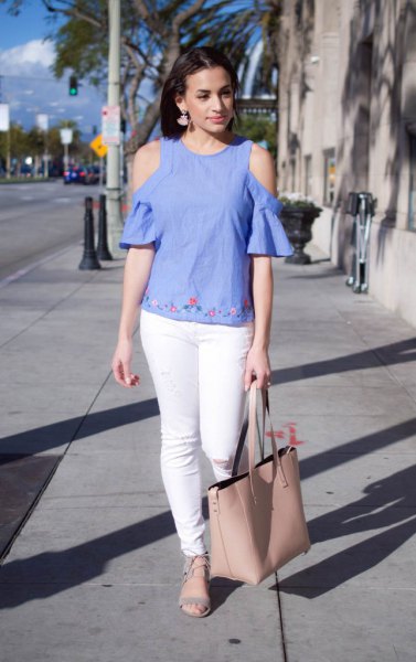 Cold shoulder blouse made of blue linen with subtle embroidery