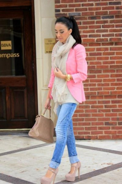 pink blazer with blue slim fit jeans and high heels