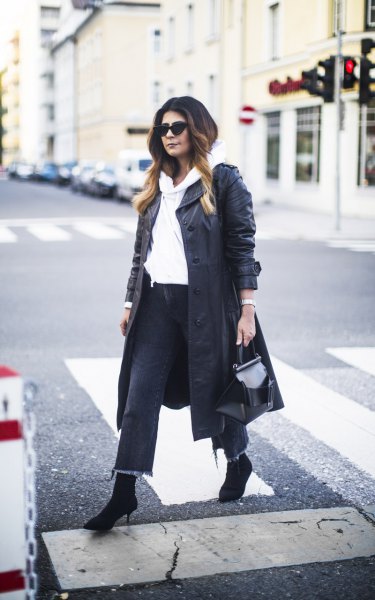 long leather coat with white hoodie and short jeans