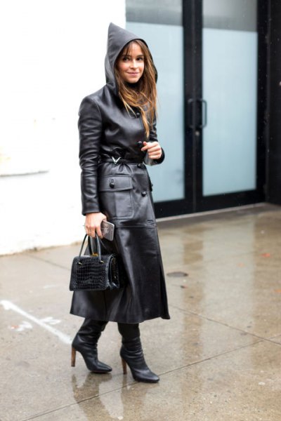 black maxi leather trench coat with hood and heeled boots