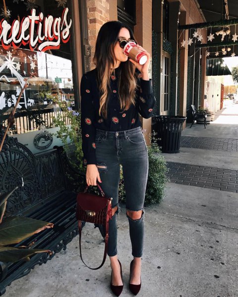 black printed blouse with gray high waisted ripped jeans