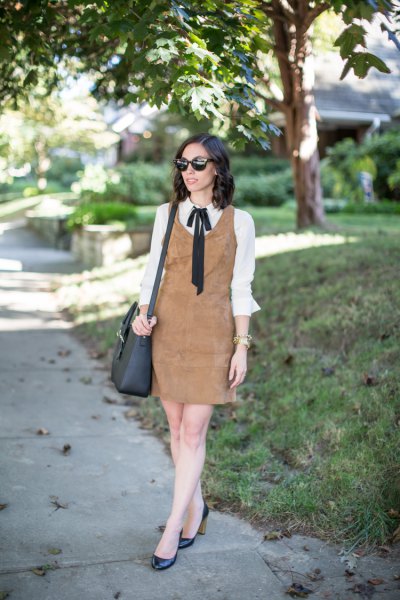 brown suede shift dress over white bow tie shirt