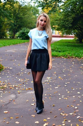 Light sky blue blouse with black mini skirt